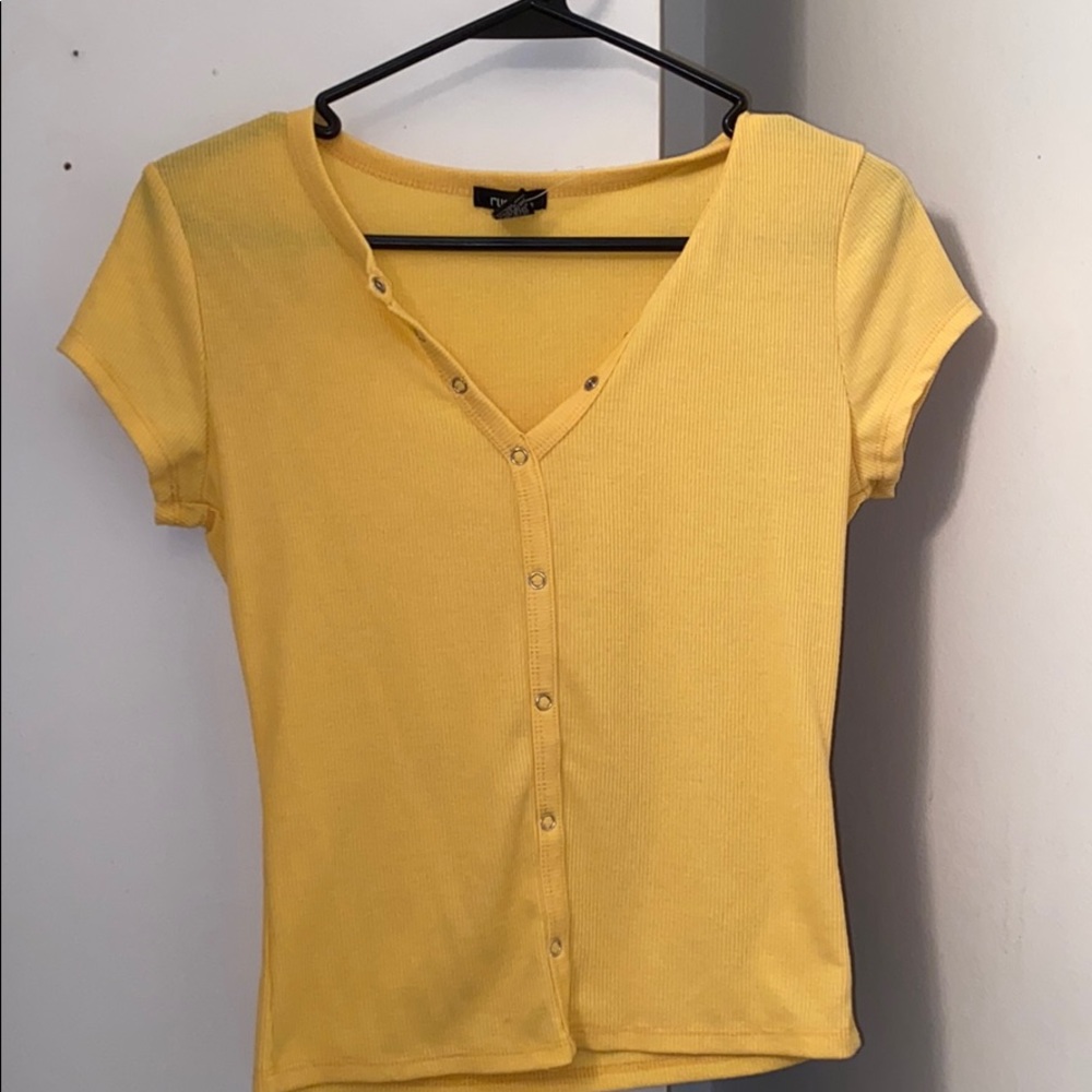 cropped yellow button